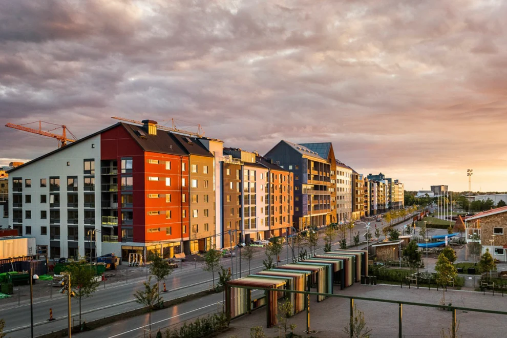 A group of buildings sitting next to each other under a cloudy sky.